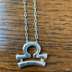 Silver Libra Zodiac Necklace. 16 inches